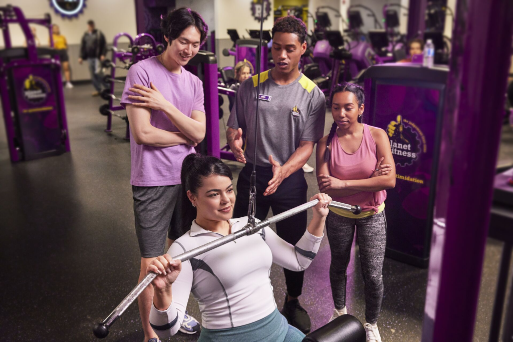 Planet Fitness trainer giving live feedback